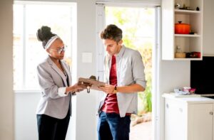 Landlord reviewing legal documents with tenant