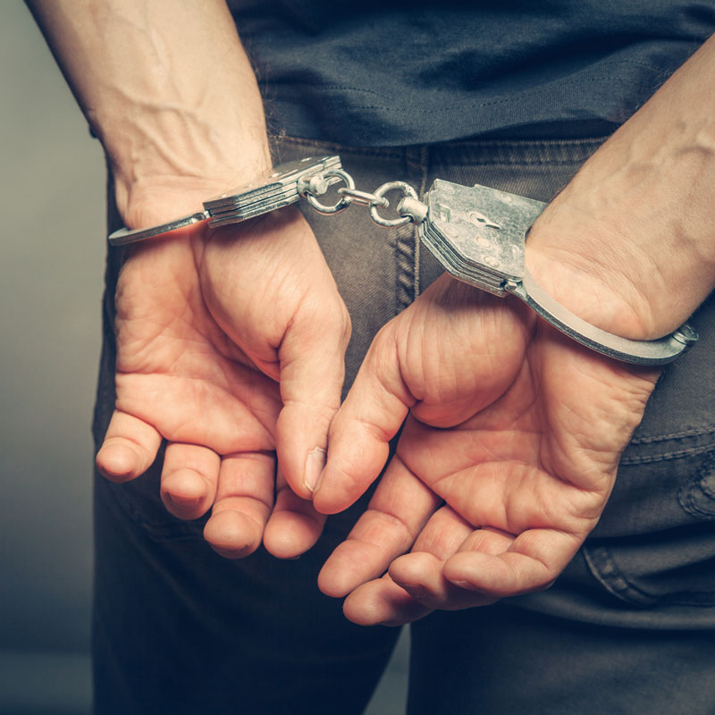 Close-up of man in handcuffs