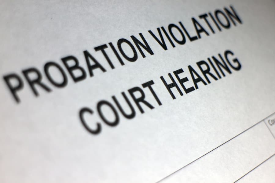 Close-up of document that says “probation violation court hearing”