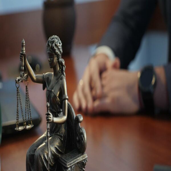 Close-up of a statue of justice on a table