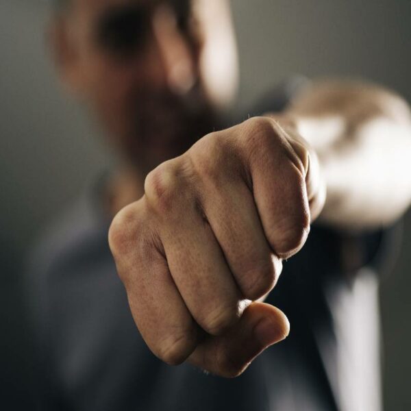 Close-up of a man throwing a punch