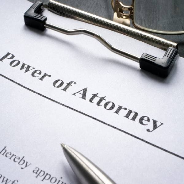 Clipboard with power of attorney document and pen